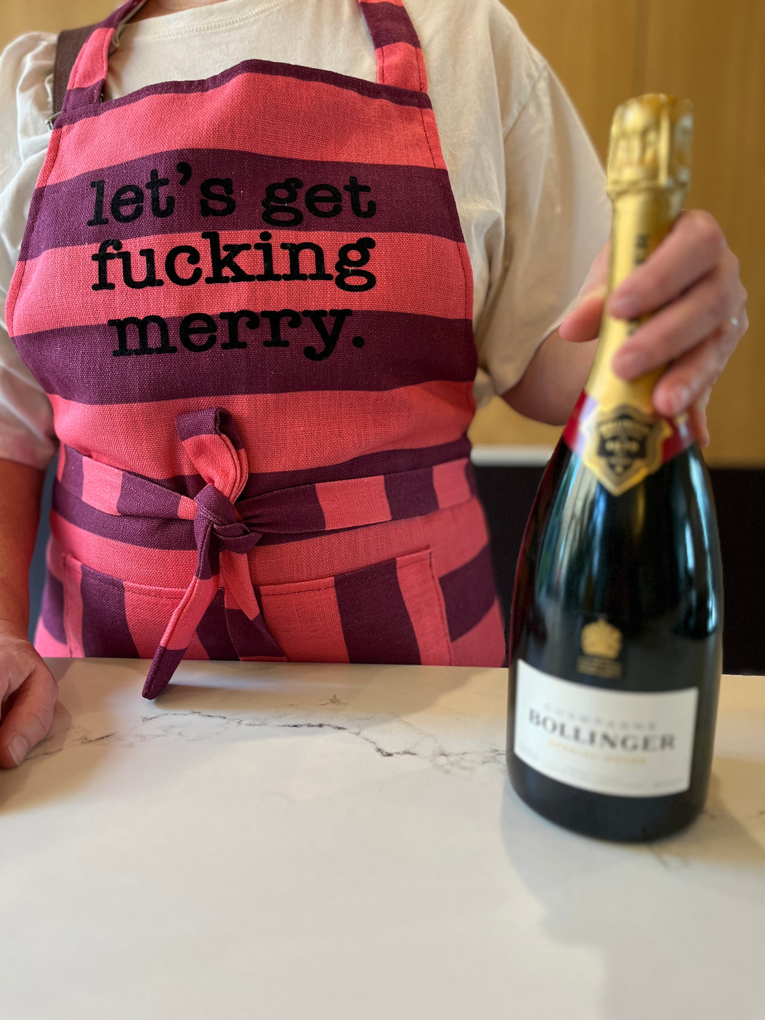CORAL & BURGUNDY STRIPE RUFFLE APRON WITH CUSTOM TEXT 'LET'S GET FUCKING MERRY'